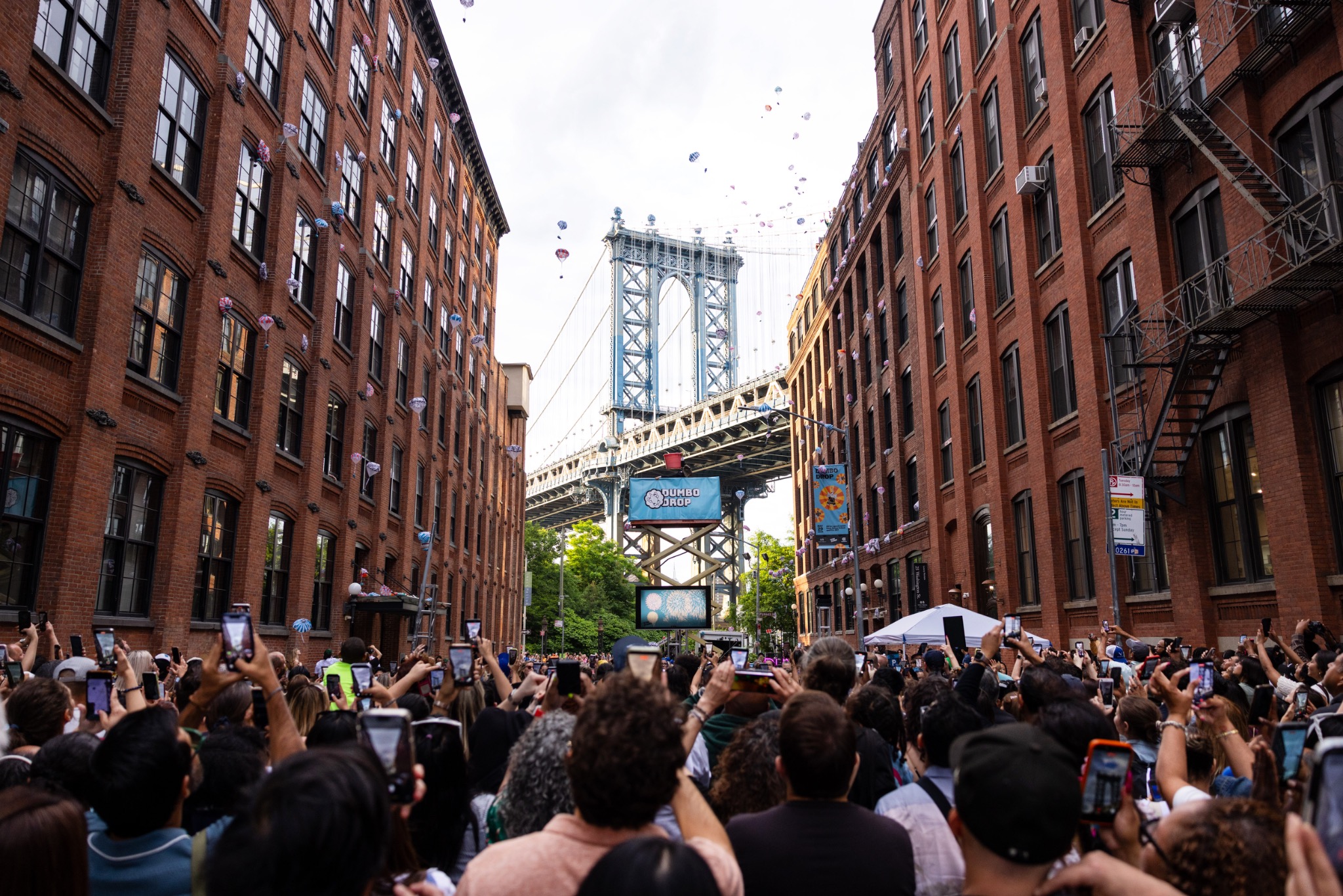 Crowd gathered at Dumbo Drop beneath the Manhattan Bridge in Brooklyn